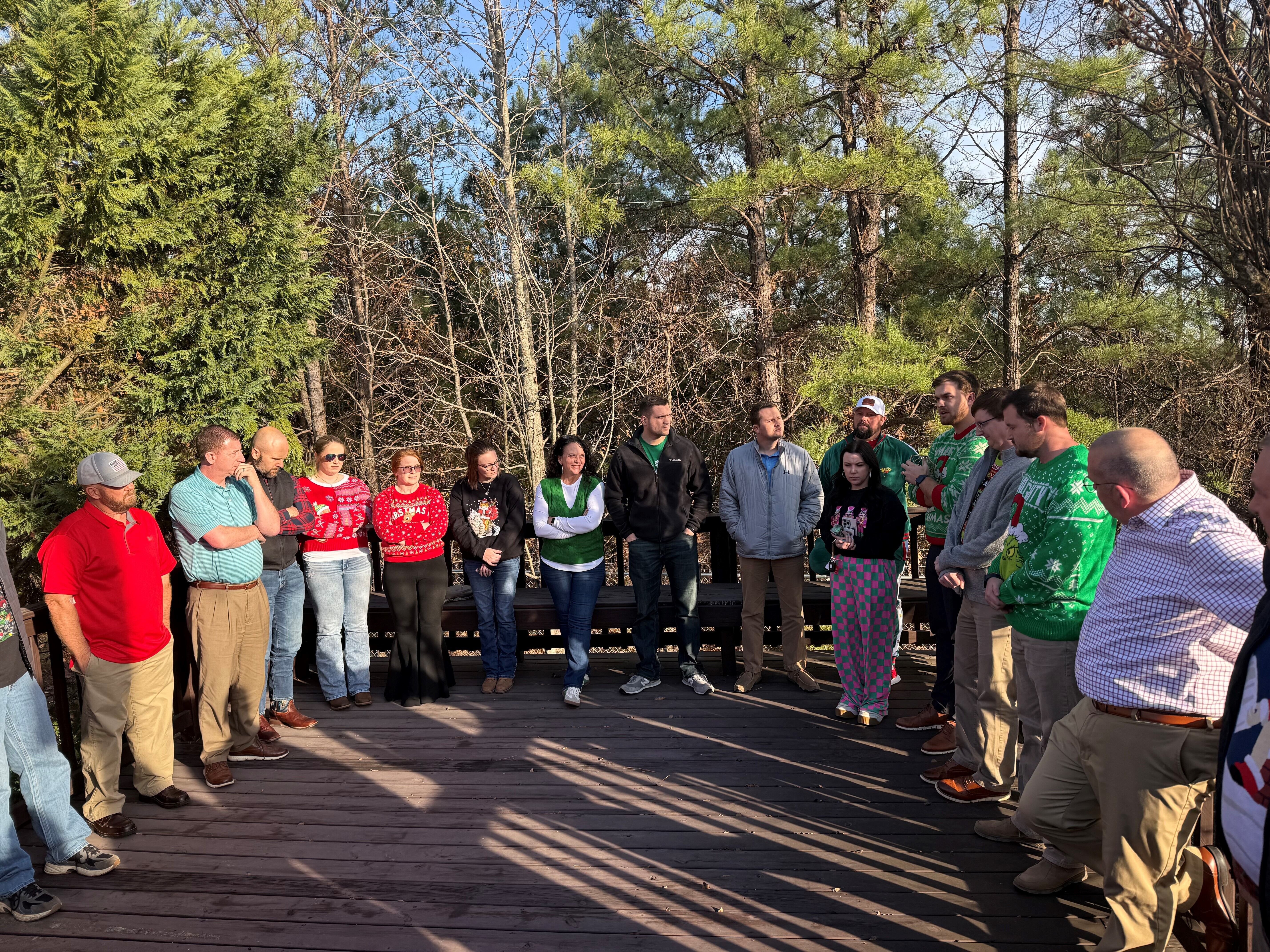 Leadership Paragould class sitting around a campfire