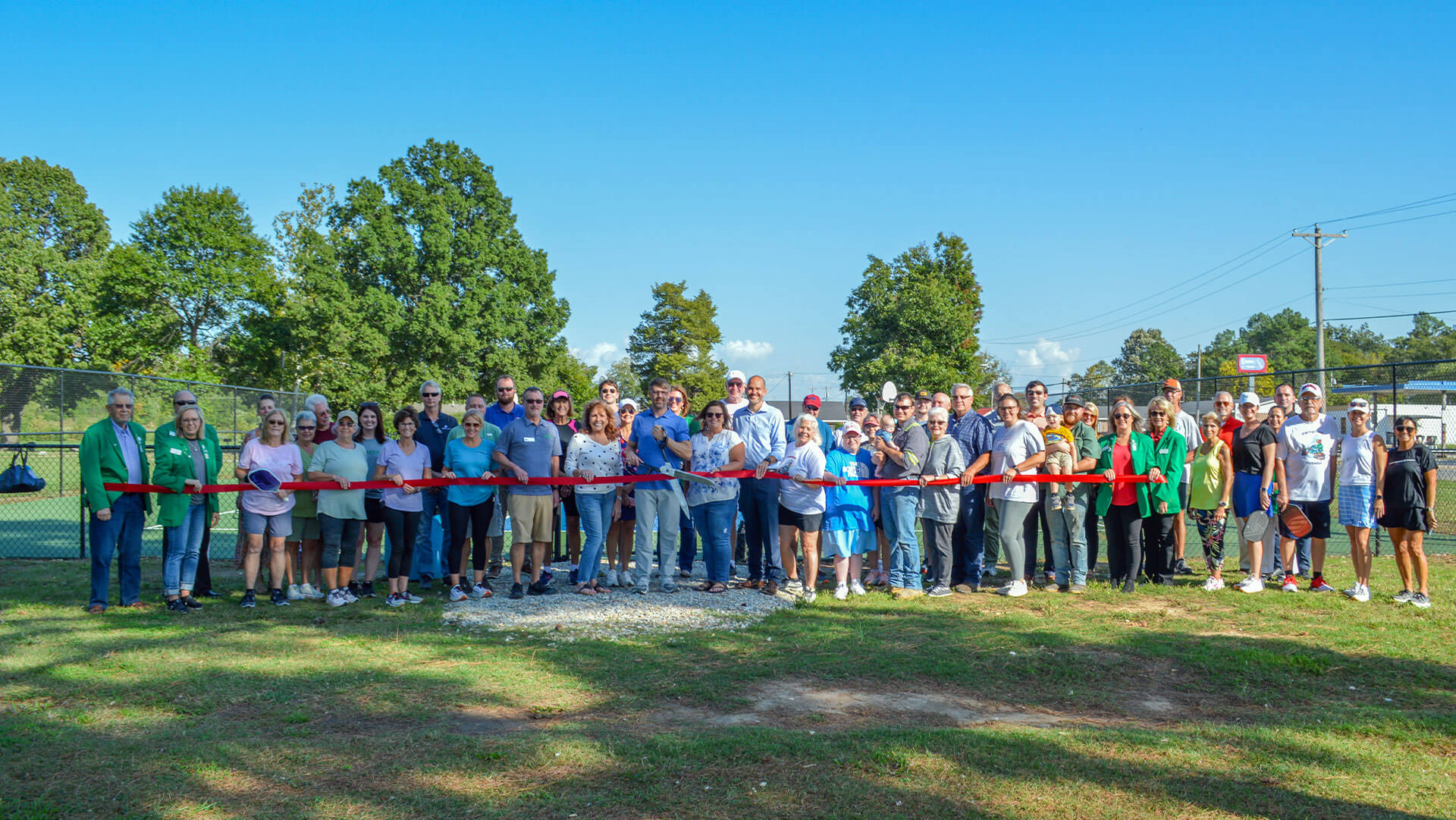 Cutting the Ribbon at Harmon Park & Cheers with the Chamber!