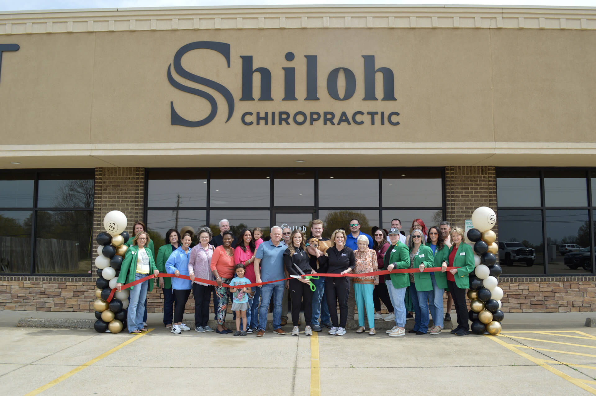 Ribbon Cutting in front of Shiloh Chiropractic building, and building facade