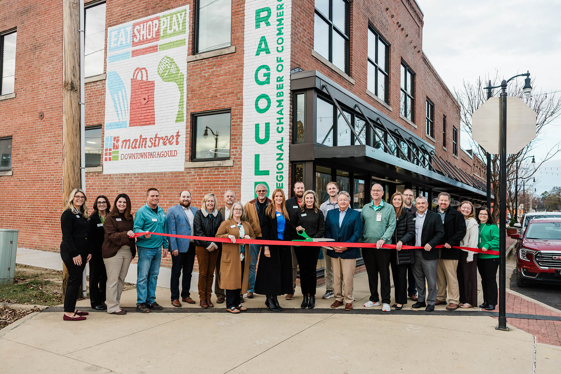 Community leaders celebrating the ribbon cutting for the new Paragould Regional Chamber of Commerce office