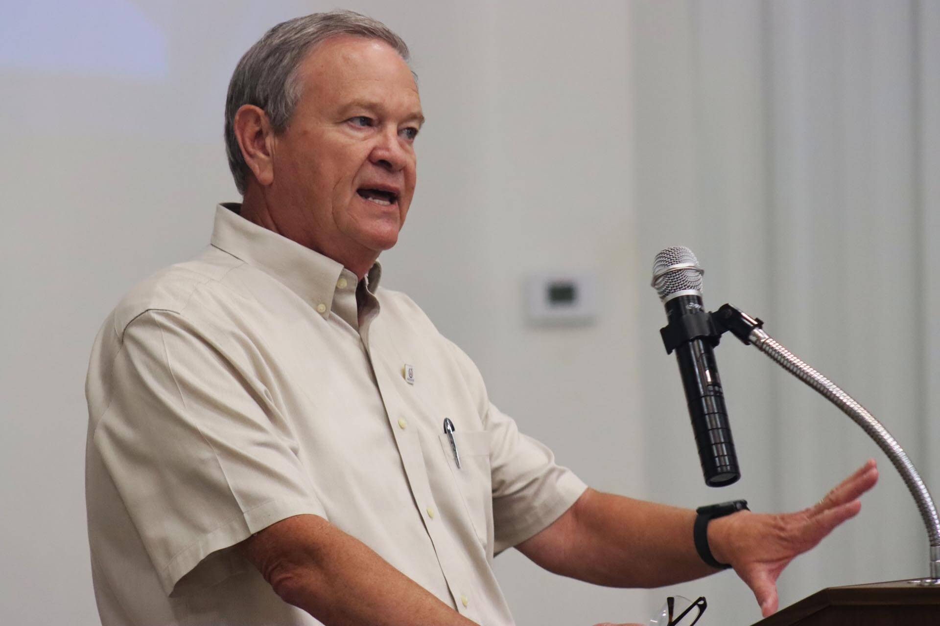 man talking at podium